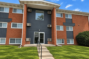 Decatur apartment for rent - A red brick building with a black door and windows.