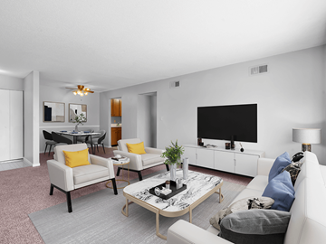 Cedar Rapids apartment for rent - a living room with white furniture and a large tv