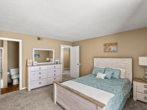 Kansas City apartment for rent - a bedroom with a bed and a bathroom with a toilet