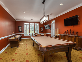 Scott Depot apartment for rent - A pool table in a room with orange walls.