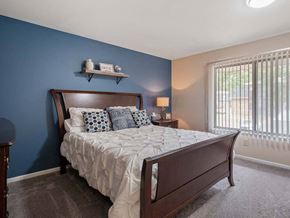 Muskegon apartment for rent - a bedroom with a bed and a window