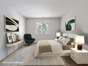 Maumee apartment for rent - A modern bedroom with a large bed, a chair, and window