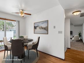 Rochester townhouse for rent - A dining room with a table and chairs.