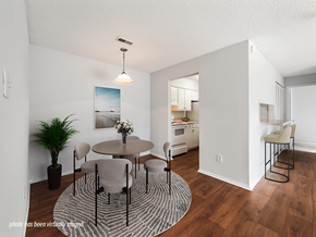Fayetteville apartment for rent - A dining room with a round table and chairs.