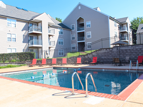 Maryland Heights apartment for rent - A swimming pool in front of apartment buildings.