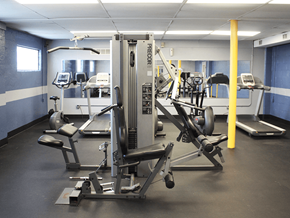 Cincinnati apartment for rent - Apartment community gym with a variety of equipment including weight machines