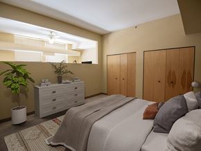 Cleveland townhouse for rent - A bedroom with a bed, dresser, and plant.