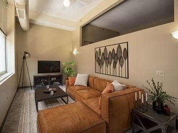 Cleveland townhouse for rent - A living room with a brown couch and a black coffee table.