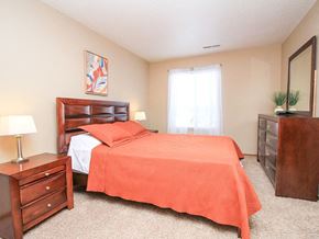 South Sioux City apartment for rent - a bedroom with a bed and a dresser