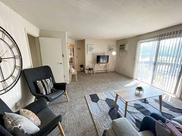 Fairborn apartment for rent - a living room with a couch and a table