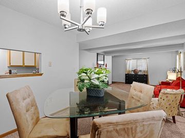 Topeka apartment for rent - a living room with a glass table and chairs