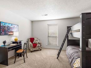 Topeka apartment for rent - a bedroom with a bunk bed and a desk