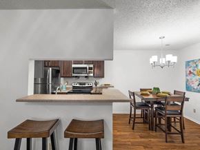 Topeka apartment for rent - a kitchen with a bar and a dining table