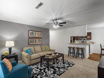 Topeka apartment for rent - a living room with a couch and a table