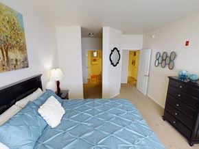 Minot apartment for rent - a bedroom with a large bed and a dresser