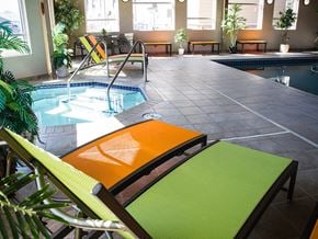 Minot apartment for rent - a pool area with lounge chairs and a plunge pool