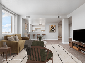 Toledo apartment for rent - A living room with a couch, chair, and television.
