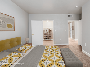 Toledo apartment for rent - A bedroom with a bed and a painting on the wall.