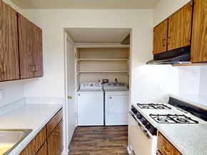 Maryland Heights townhouse for rent - A kitchen with a white stove top oven and a white dishwasher.