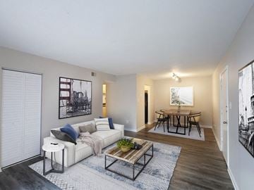 New Bern apartment for rent - A living room with a white couch and a coffee table.