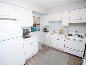 Sioux City apartment for rent - apartment kitchen with white cabinets and white appliances