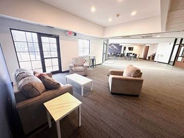 Brooklyn Park apartment for rent - a large living room with couches and chairs and a table