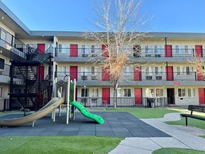 Denver apartment for rent - a playground with a slide in front of an apartment building