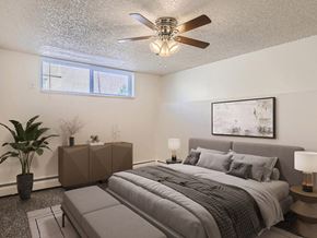 Golden apartment for rent - Bedroom with window and fan