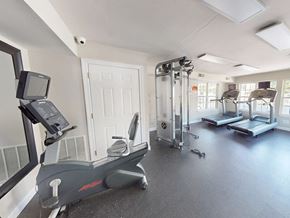 Florissant apartment for rent - A gym with treadmills, elliptical machines, and other exercise equipment.