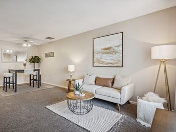 Cedar Rapids townhouse for rent - a living room with a couch and a table