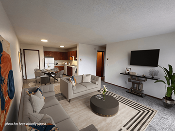 Waite Park apartment for rent - A living room with a grey couch and a coffee table.