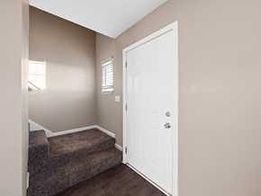 Clarksville apartment for rent - an empty entryway with a white door and carpeted stairs