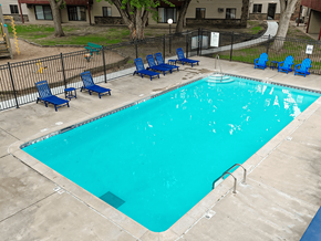 Waite Park apartment for rent - A small pool with blue chairs around it.