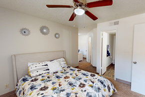 Albuquerque apartment for rent - A bedroom with a bed and a ceiling fan.