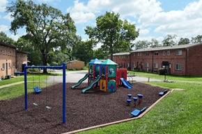 St. Louis apartment for rent - A playground with a slide, swings, and a sandbox.
