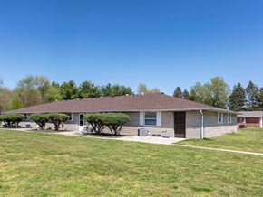 Terre Haute apartment for rent - a house with a lawn and trees in front of it