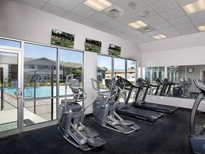 Evansville townhouse for rent - fitness center overlooking pool at north park apartments