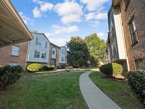 Clarksville apartment for rent - A residential area with houses and a walkway.