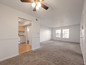 Clarksville apartment for rent - A room with a ceiling fan and carpeted floor.