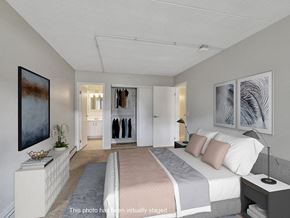 Rochester apartment for rent - a bedroom with a bed and a closet