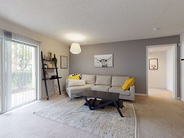 Valley Park apartment for rent - a living room with a couch and a table