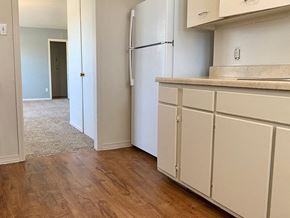 Amarillo apartment for rent - a kitchen with white cabinets and a white refrigerator