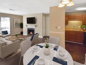 Jackson apartment for rent - a dining area with a table and chairs and a fireplace in the background