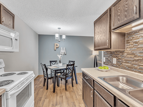 Waite Park apartment for rent - a kitchen and dining room with a table and chairs