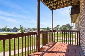Private wood stained balcony in select homes
