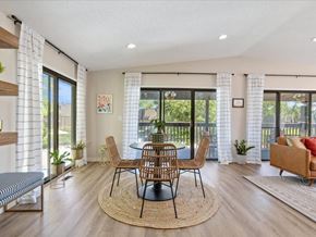 Cedar Rapids apartment for rent - a dining room with a table and chairs and a balcony