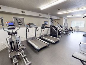Greeley apartment for rent - A gym with treadmills, elliptical machines, and other exercise equipment.