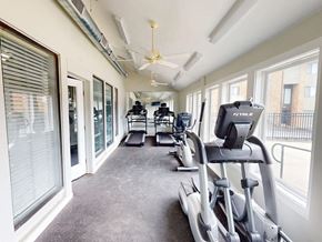 Florissant townhouse for rent - A gym with treadmills and elliptical machines.
