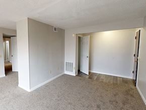 Florissant townhouse for rent - A room with white walls and carpeted floor.