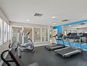 Kansas City townhouse for rent - apartment gym is equipped with weights and cardio equipment